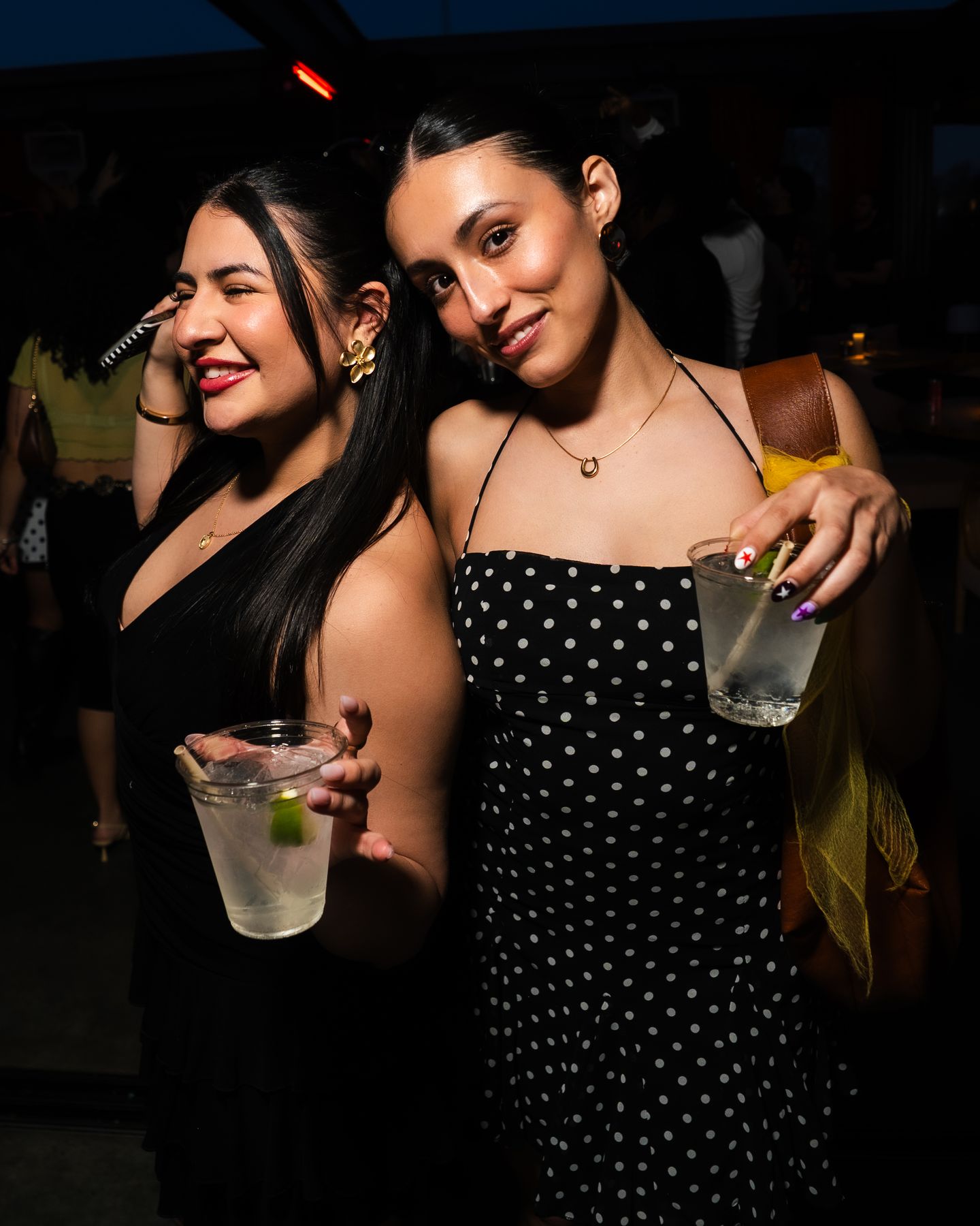 Friends in polka dots toasting the night