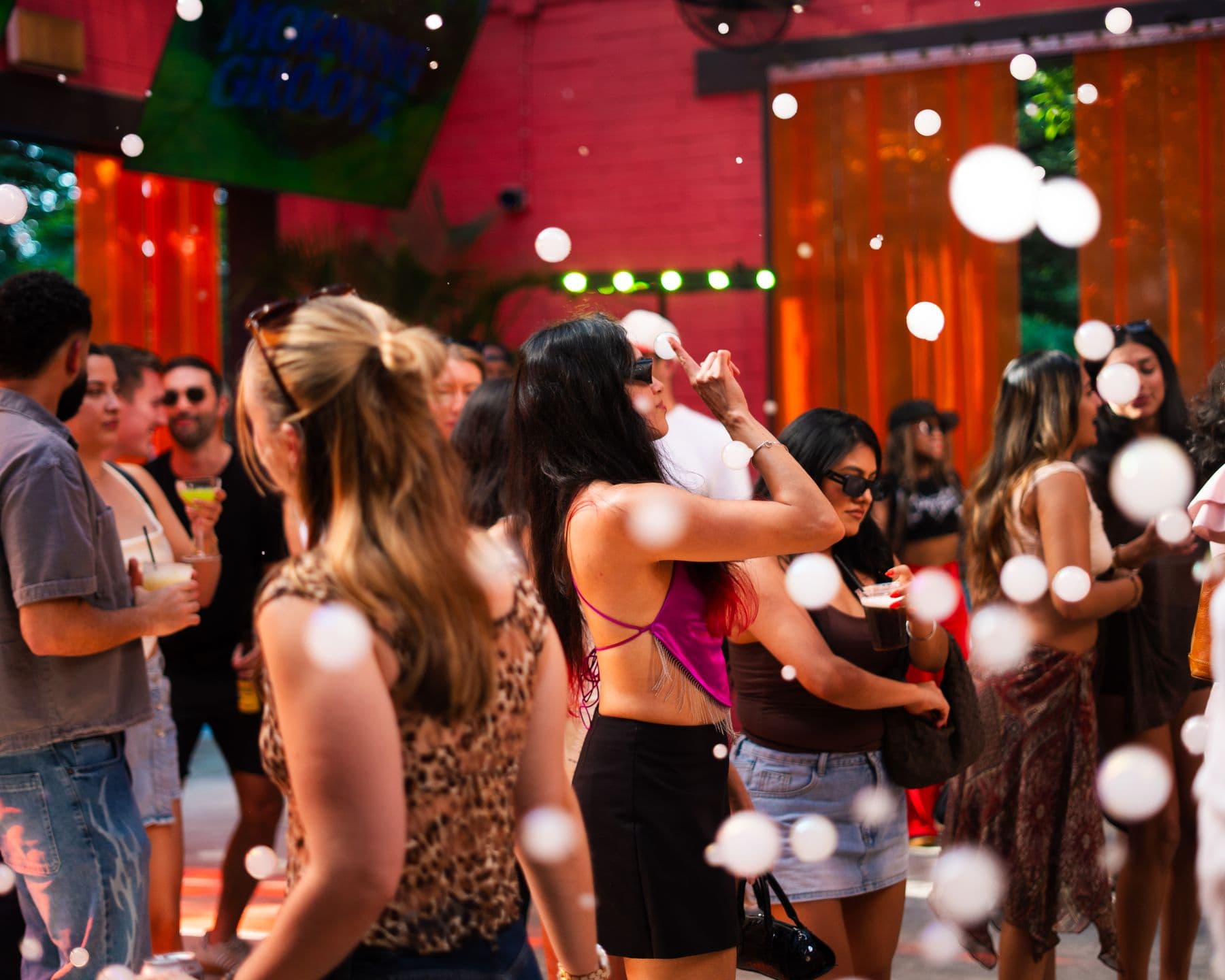 The dance floor and bubbles under the red canopy