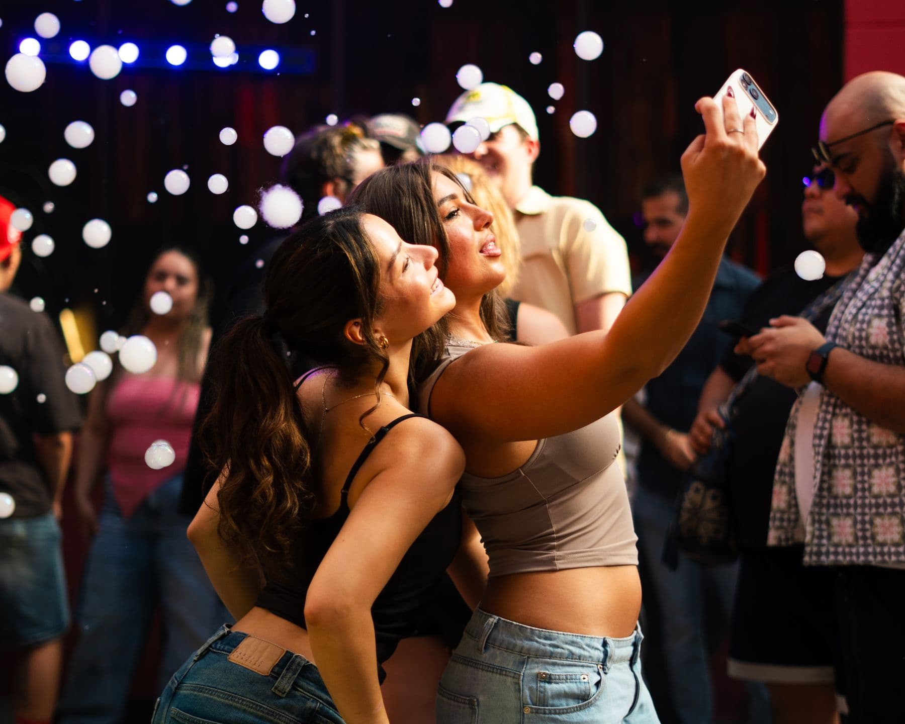 Friends taking a selfie in the bubbles