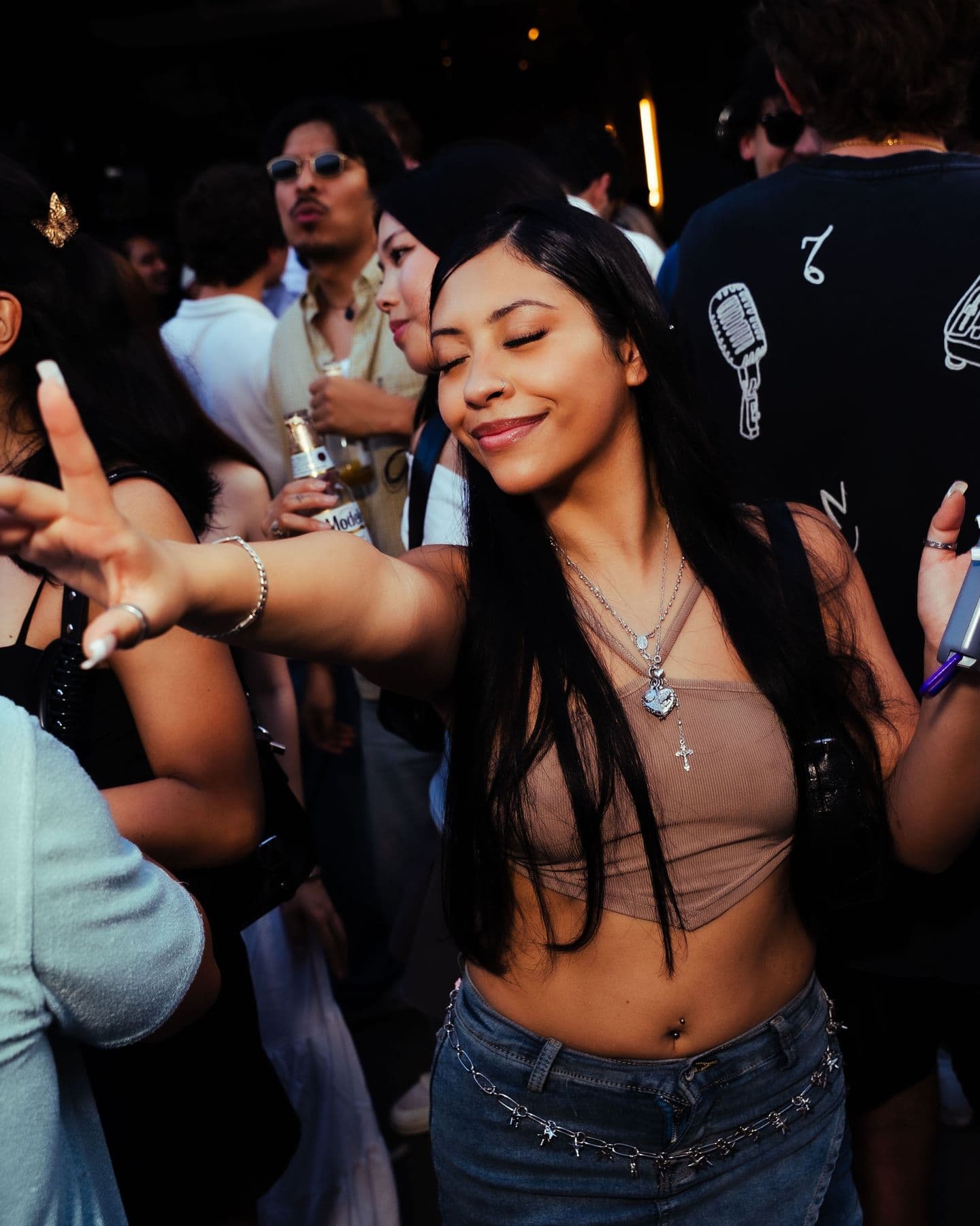 A dancer lost in the music, eyes closed